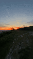Sunset observed from Varna hillside, two figures silhouetted