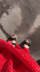 Person in polka dot dress walks Khimki streets