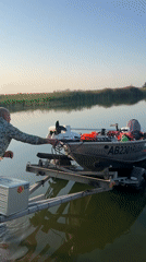 Boat launch with fishing gear at a Russian waterway