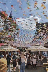 Gdańsk Old Town market day, fountains and flags in full swing