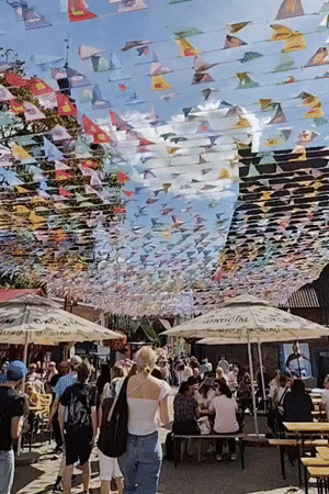 Gdańsk Old Town market day, fountains and flags in full swing