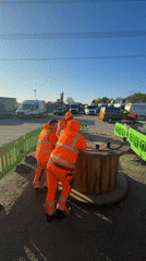 Construction workers gather at Mid Suffolk building site