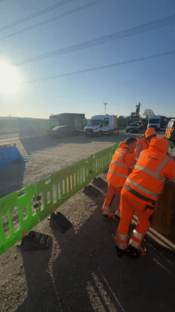 Construction workers gather at Mid Suffolk building site