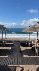 Tourist documents sunny morning scenes across Budva, Montenegro waterfront