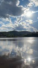 Still lake and carved railing at Mont-Tremblant lookout