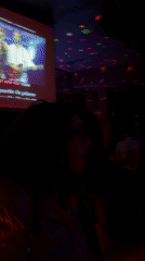 Woman in white tank top spotted at Geneva karaoke bar