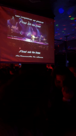 Woman in white tank top spotted at Geneva karaoke bar