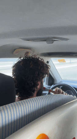 Driver with surfboard captured on video in Lotan