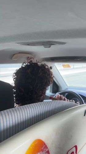 Driver with surfboard captured on video in Lotan