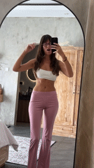 Woman documents outfit changes in North Kuta hotel selfie session