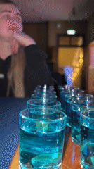 Blue drinks served on wooden tray in Ust-Ilimsk
