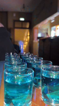 Blue drinks served on wooden tray in Ust-Ilimsk