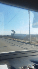 Car crosses bridge in Yakutsk under clear skies
