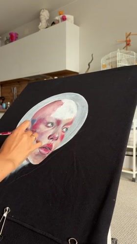 Monochrome portrait painted on black canvas in Krasnoyarsk