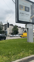 Ambulance responds through Krasnodar intersection during morning hours