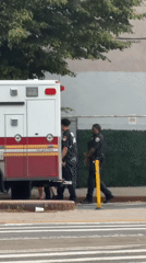 Ambulance crew observed on New York street with vehicle door open