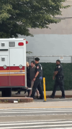 Ambulance crew observed on New York street with vehicle door open