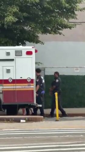 Ambulance crew observed on New York street with vehicle door open