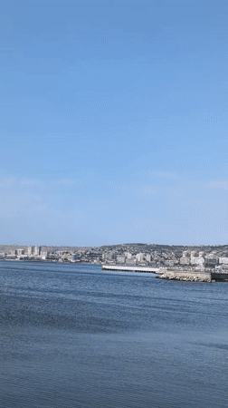Baku's waterfront and Flame Towers on a clear summer morning