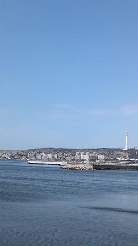 Baku's waterfront and Flame Towers on a clear summer morning