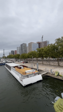 Swiss river cruiser passes the Eiffel Tower on the Seine
