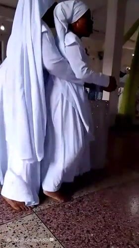 Women in white robes gather for religious ceremony in Lagos