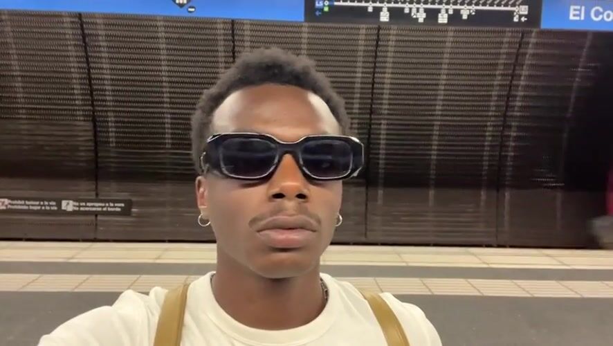 Pausing on a Barcelona metro platform as a train rolls through