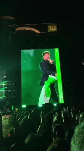Live stage performance with flag in Montreal