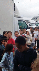 Youth group tours a pizza and food prep kitchen in Bucharest