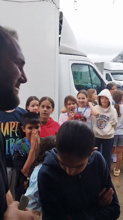 Youth group tours a pizza and food prep kitchen in Bucharest