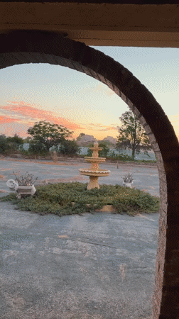 Sunset hot tub session at a Corvera courtyard with fountain views