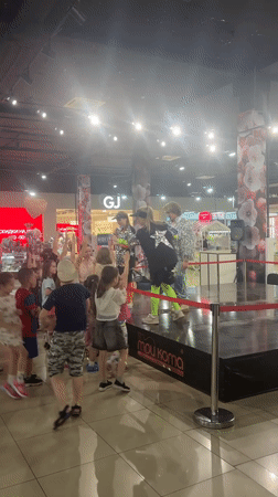 Children imitate dancers at mall performance in Astrakhan