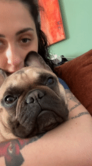 Woman poses with French bulldog in Varna, Bulgaria