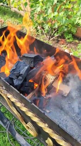 Backyard grill burning in a rural Belarusian yard