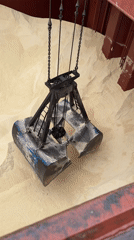 Clamshell cranes unload bulk cargo at Casablanca port