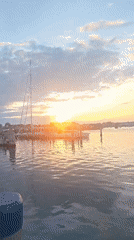 Nantucket Harbor at golden hour, boats and fading light