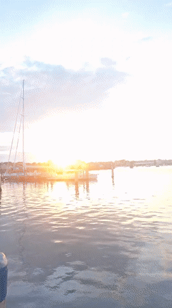 Nantucket Harbor at golden hour, boats and fading light
