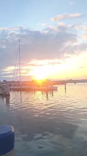 Nantucket Harbor at golden hour, boats and fading light