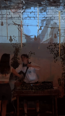 Behind the decks at a low-key indoor gathering in Belgrade