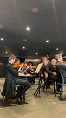 Tango orchestra rehearsal documented in Buenos Aires performance space