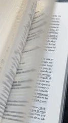 Person reads Spanish book, takes selfie in Santa Clara Ocoyucan