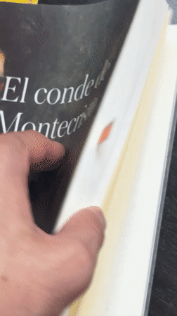 Person reads Spanish book, takes selfie in Santa Clara Ocoyucan