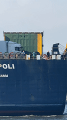 Cargo ship passes anglers fishing from Varna shoreline