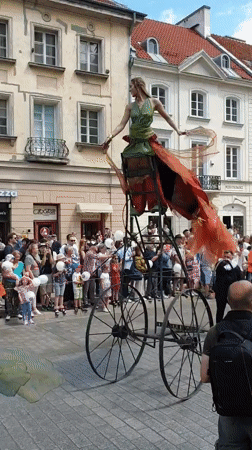 Street parade with floats and performers draws crowds in Warsaw