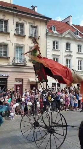 Street parade with floats and performers draws crowds in Warsaw