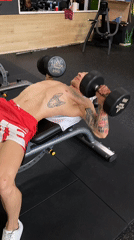 Tattooed man works out at Pleven gym early morning