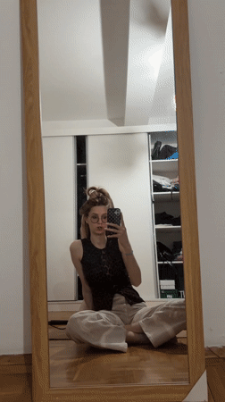 Young women take mirror selfies in Kragujevac apartment