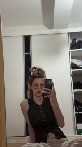 Young women take mirror selfies in Kragujevac apartment