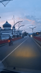 Evening roadside mosque scene captured in Baro, Indonesia