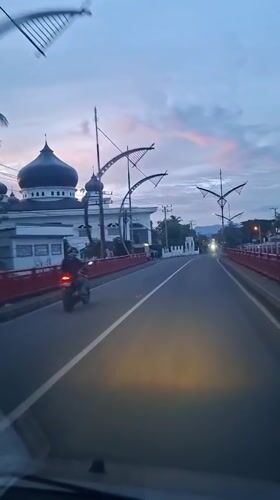 Evening roadside mosque scene captured in Baro, Indonesia